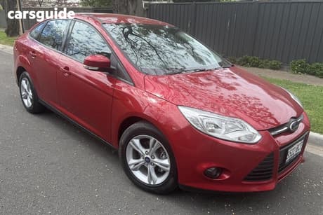 Red 2014 Ford Focus Sedan Trend