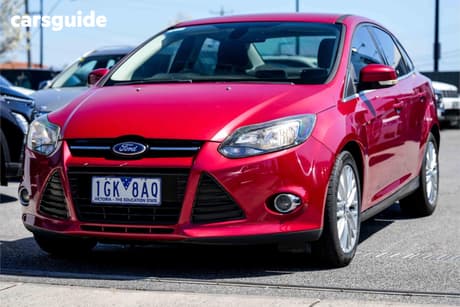 Red 2011 Ford Focus Sedan Sport
