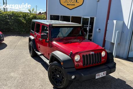 Red 2012 Jeep Wrangler Softtop Unlimited Sport (4X4)