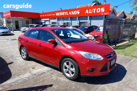 Red 2013 Ford Focus Sedan Trend