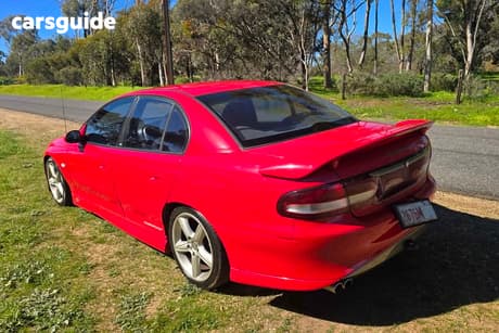 Red 2000 Holden Commodore Sedan