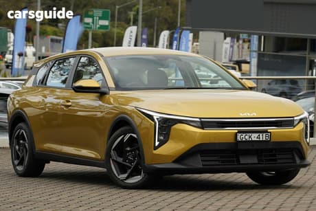 Yellow 2025 Kia K4 Sedan Sport