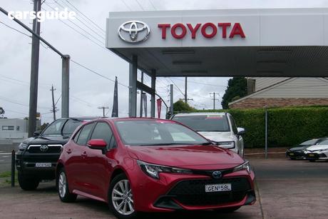 Red 2025 Toyota Corolla Hatchback Ascent Sport Hybrid