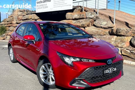 Red 2023 Toyota Corolla Hatchback Ascent Sport Hybrid