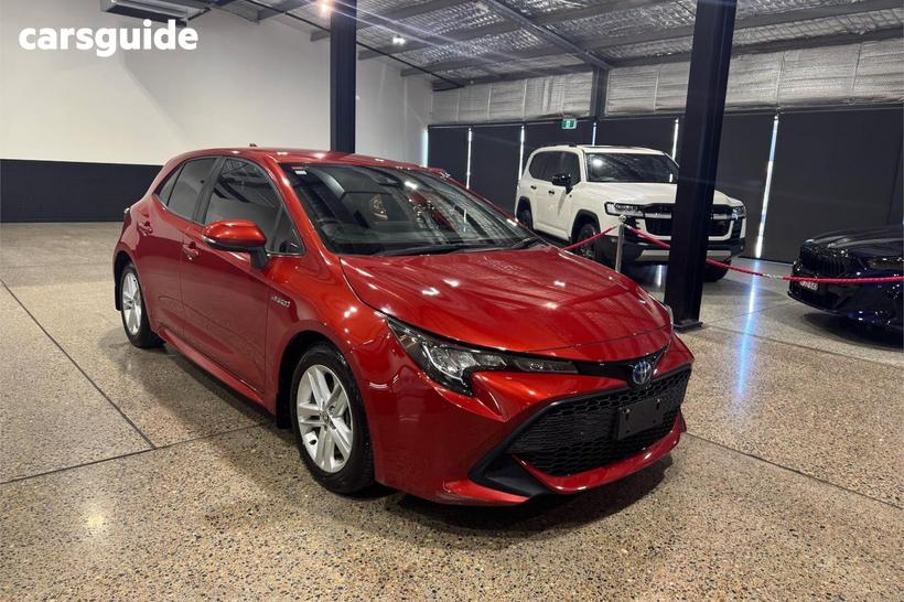 Orange 2018 Toyota Corolla Hatchback Ascent Sport (Hybrid)