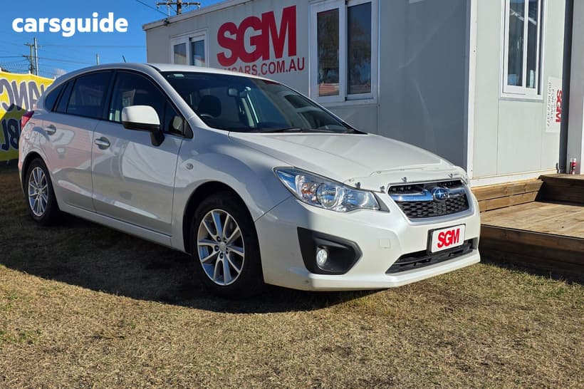 White 2012 Subaru Impreza Hatchback 2.0I-L (Awd)
