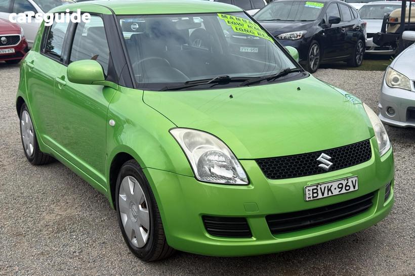 Green 2010 Suzuki Swift Hatchback