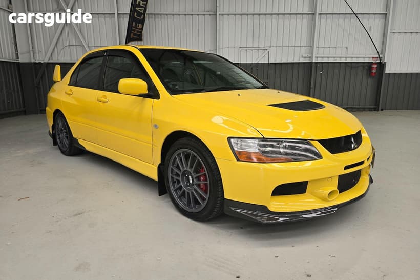 Yellow 2006 Mitsubishi Lancer Sedan Evolution Ix