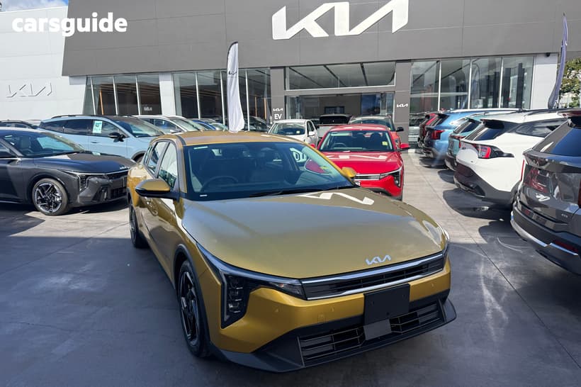 Yellow 2026 Kia K4 Hatchback Sport+
