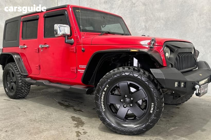 Red 2012 Jeep Wrangler Softtop Unlimited Sport (4X4)