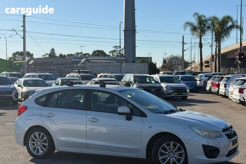 White 2012 Subaru Impreza Hatchback 2.0I (Awd)