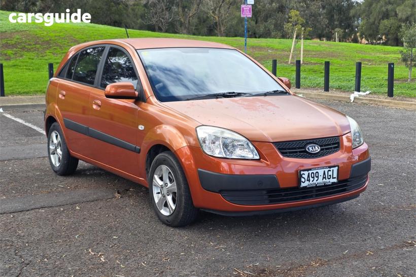 Orange 2009 Kia RIO Hatchback Lx