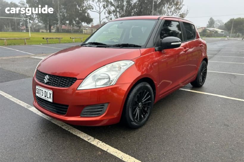 Orange 2013 Suzuki Swift Hatchback Gl