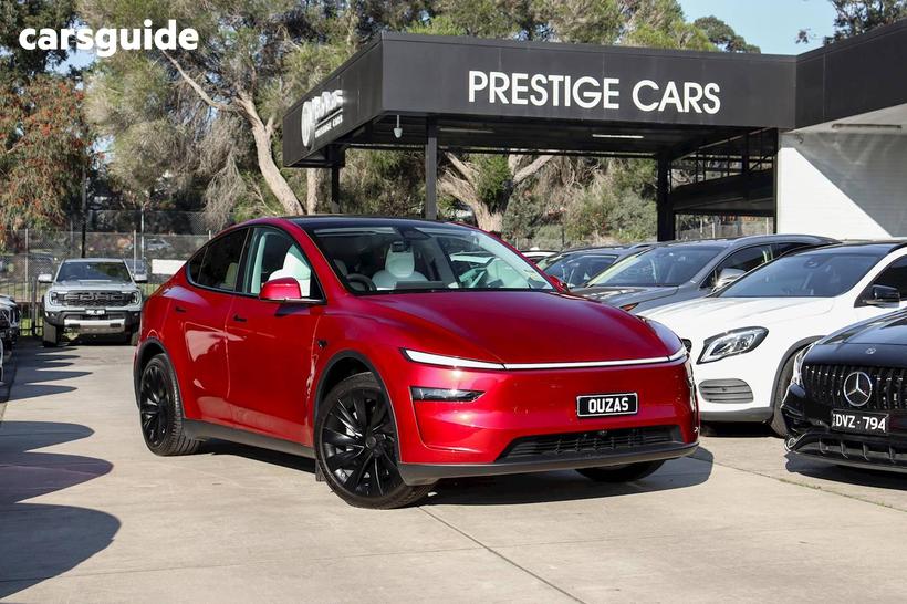 Red 2025 Tesla Model Y Wagon Long Range