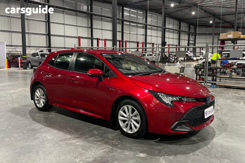 Red 2024 Toyota Corolla Hatchback Ascent Sport Hybrid