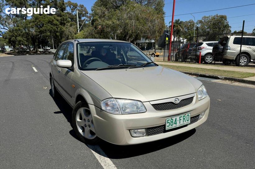 Silver 2000 Mazda 323 Hatchback Astina Shades
