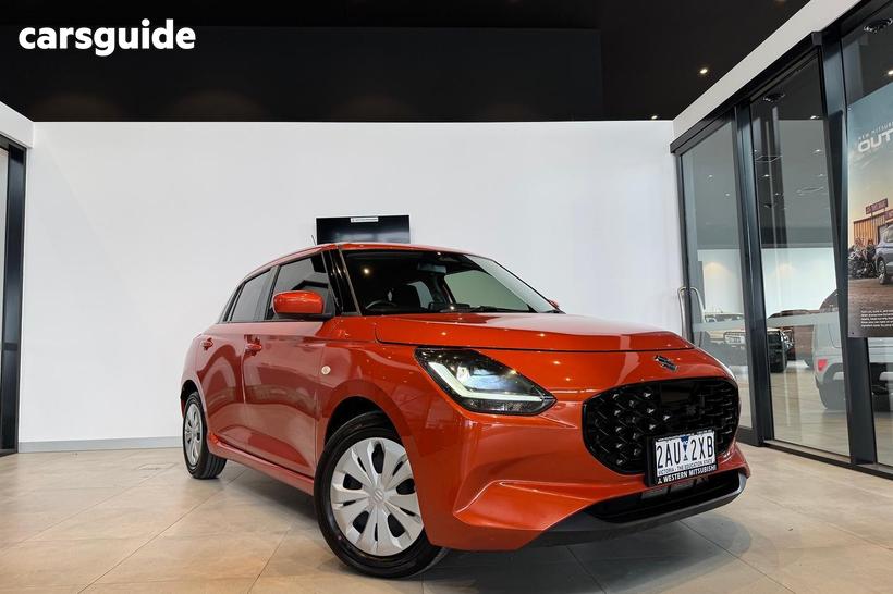 Orange 2024 Suzuki Swift Hatchback Hybrid