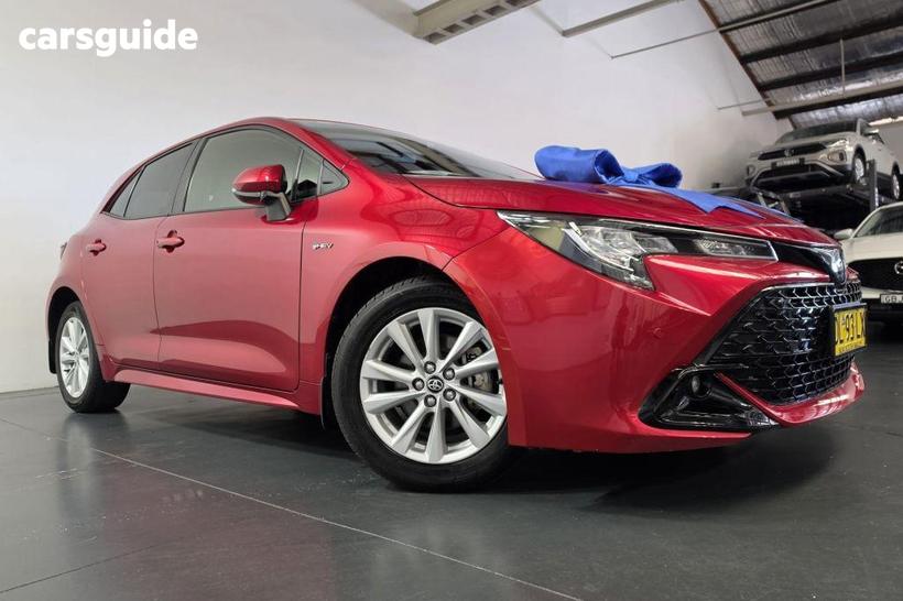 Red 2024 Toyota Corolla Hatchback Sx Hybrid